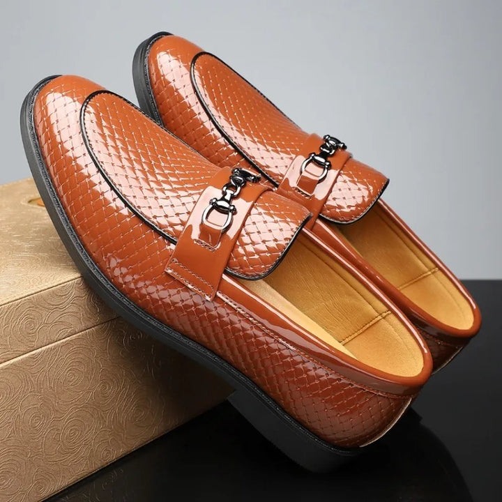 Top view of a single men's embossed leather bit loafer, presenting its elegant design and texture.