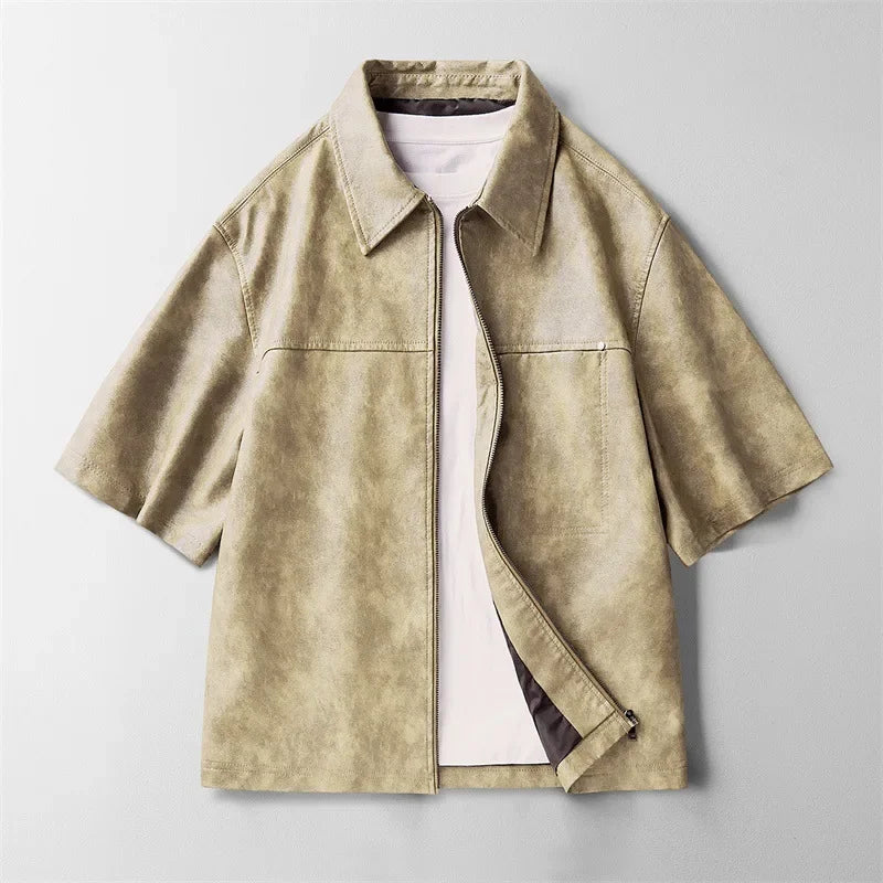 A versatile men's short-sleeve genuine leather shirt in beige, ideal for various casual occasions.