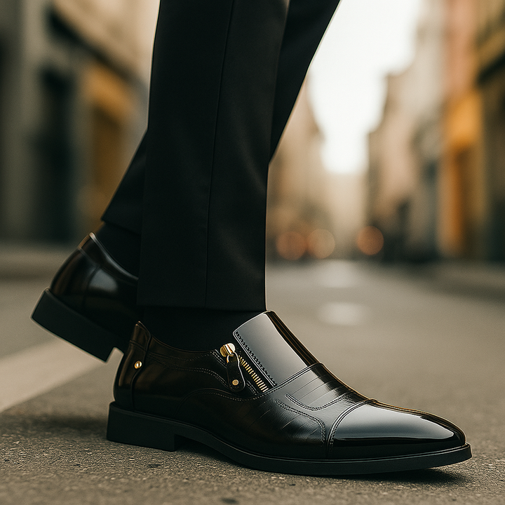 Pair of black men's glossy loafers with subtle zip details, versatile formal footwear for any discerning gentleman.