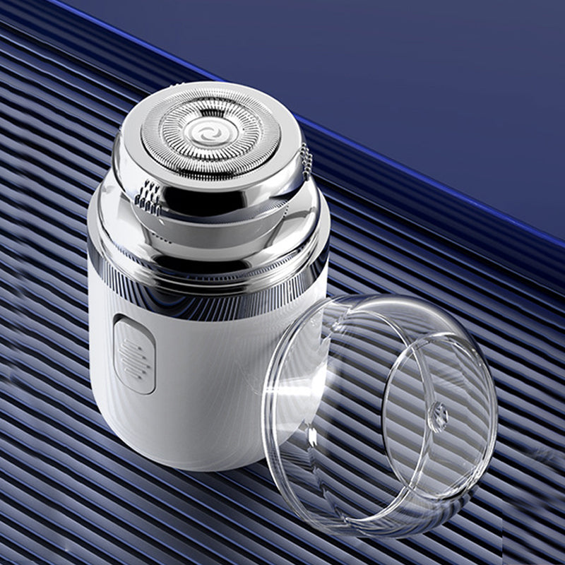 Compact electric beard trimmer with a protective cap, perfect for travel and quick shaves