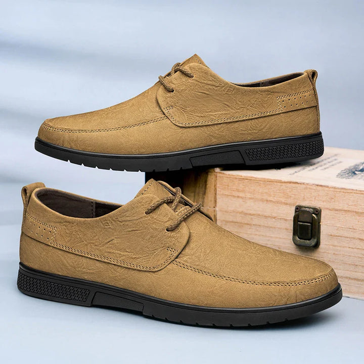 Man wearing comfortable Men's Khaki Leather Slip-On Loafers with smart casual trousers