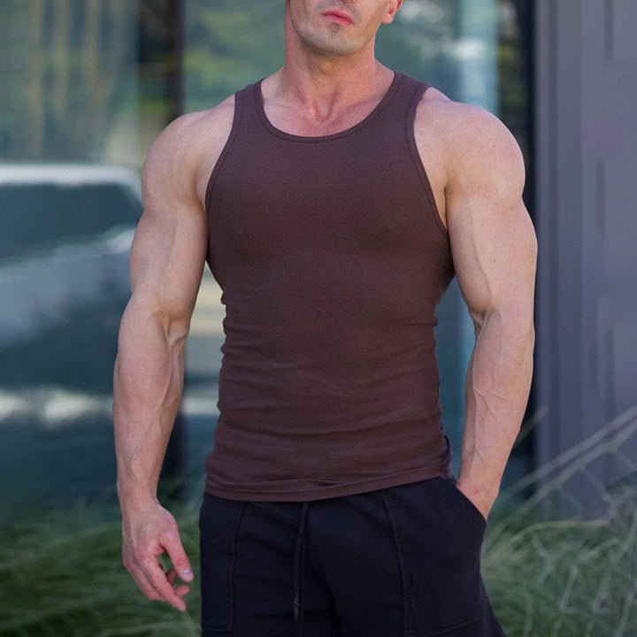 Front view of a men's premium navy sleeveless tank top, soft cotton blend for active wear.