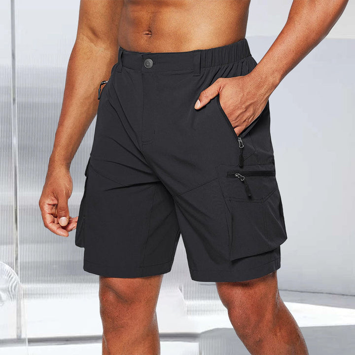 Pair of black quick-dry men's cargo shorts on a white background, highlighting texture.