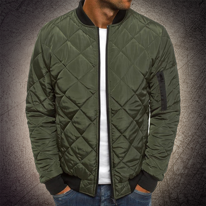 Man wearing a modern, casual men's quilted lightweight bomber jacket for everyday style.