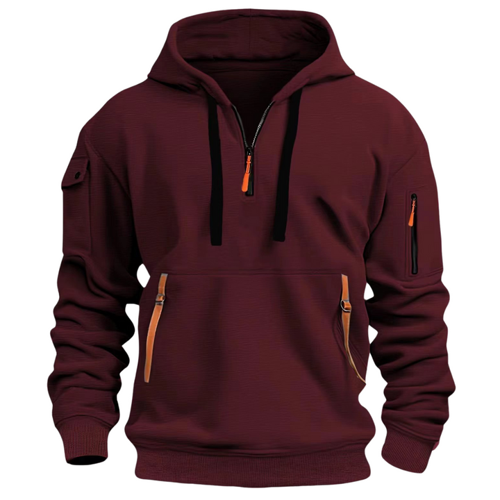 Detail shot of the fabric and utility pocket on a men's long sleeve hoodie, emphasizing quality