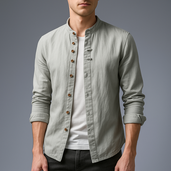 Stylish man wearing a long sleeve white cotton-linen band collar shirt, casual summer look