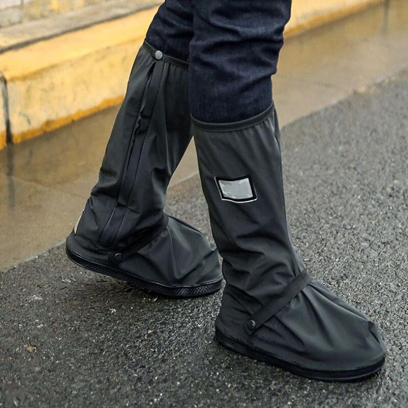 Pair of black unisex reusable waterproof shoe covers protecting sneakers from rain and mud