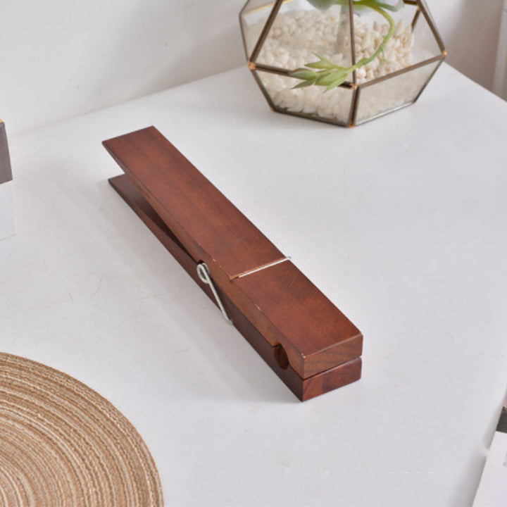 Wooden clothespin towel hanger, rustic style, wall mounted for easy access in any room.