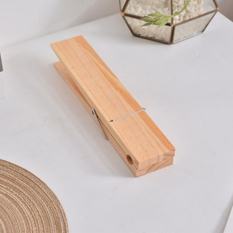 Functional rustic wooden clothespin towel holder, ideal for farmhouse or cabin bathroom decor.