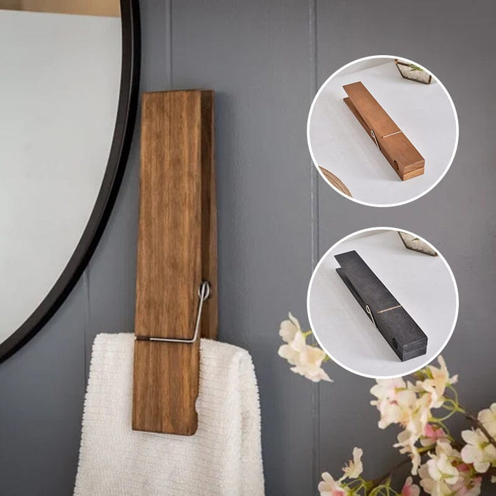 Wall mounted towel holder, rustic wood design, featuring large clothespins for a unique look.