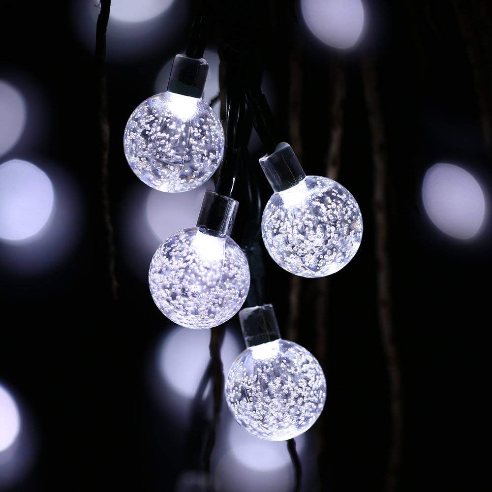Solar string lights with a visible solar panel, showcasing energy-efficient outdoor decor