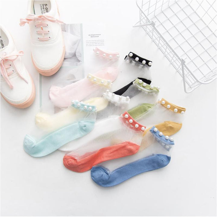 Stylish women's pearl fishnet ankle socks, fashion accessory for summer outfits.
