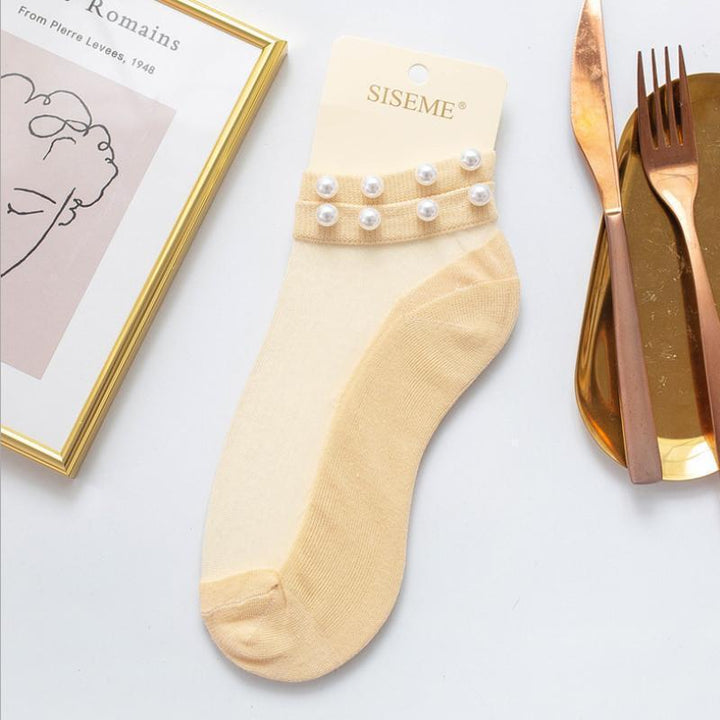 Versatile women's pearl fishnet ankle socks, suitable for casual or dressy occasions.