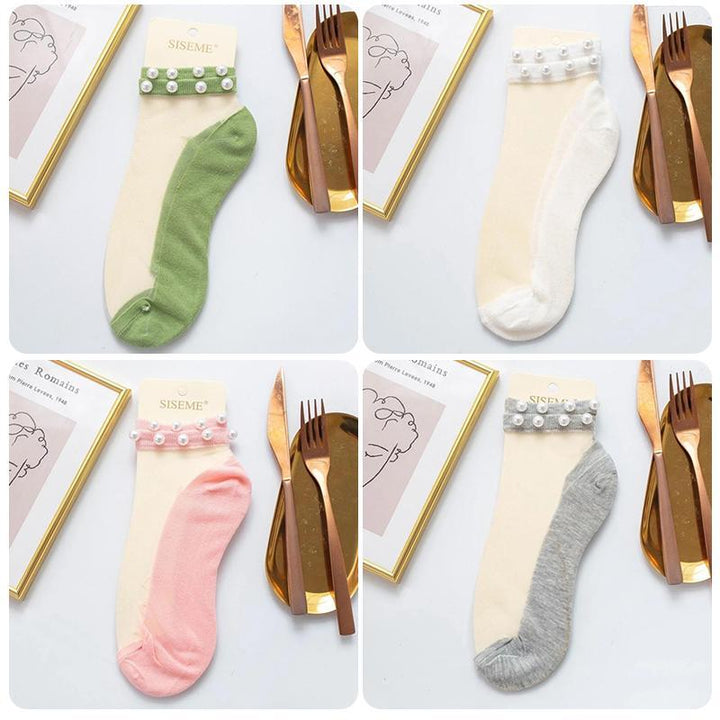 Lightweight pearl fishnet ankle socks, adding a touch of glamour to any ensemble.