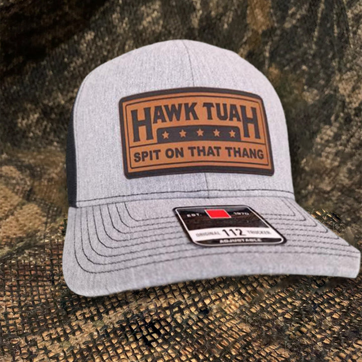 Textured image of a black cotton baseball cap, showing fabric quality and durable stitching