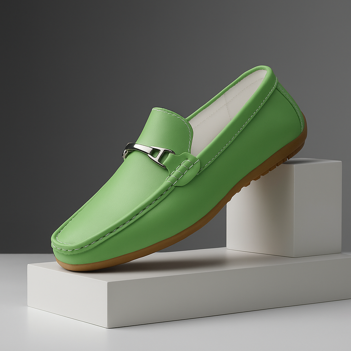 Side view of a unisex black leather slip-on loafer, emphasizing its sleek and comfortable design.