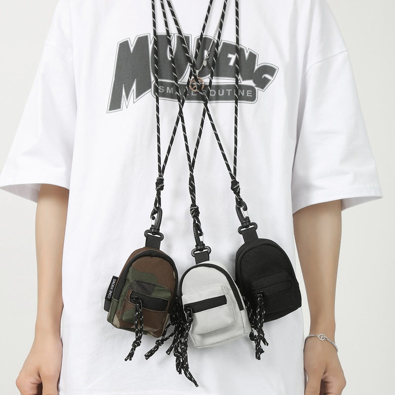 Unisex mini pendant bag in black oxford cloth, perfect for essentials and travel.