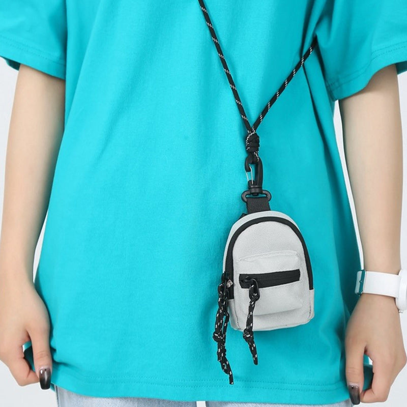 Travel-friendly mini utility pouch, lightweight and made from robust oxford cloth.