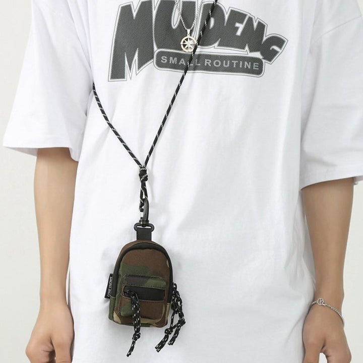 Sleek black mini crossbody pouch, an excellent travel accessory.