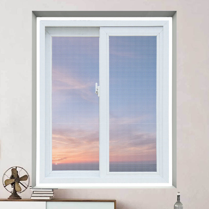 Unisex anti-mosquito window screen in a living room, blending seamlessly with home decor, pest control