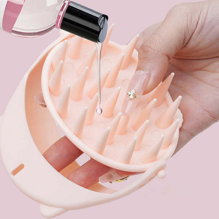 Scalp massager used during shampooing, illustrating its deep cleaning and stimulating benefits.
