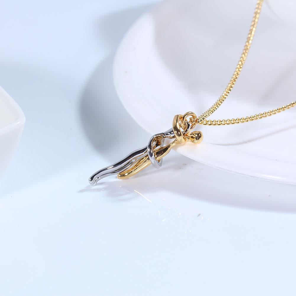 Close-up of a golden hug pendant, symbolizing love and friendship, meaningful unisex gift