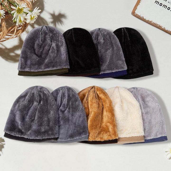 Unisex thermal knit beanie hat in navy blue, modeled on a person outdoors. Great for cold weather.