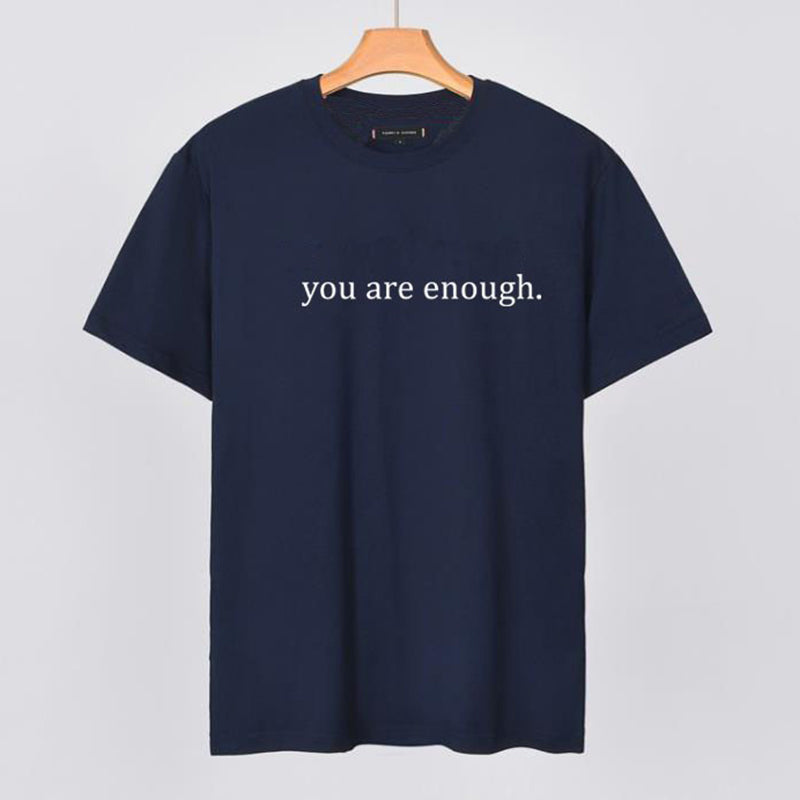 Side view of the 'You Are Enough' tee, showing the cut of this comfort wear shirt.