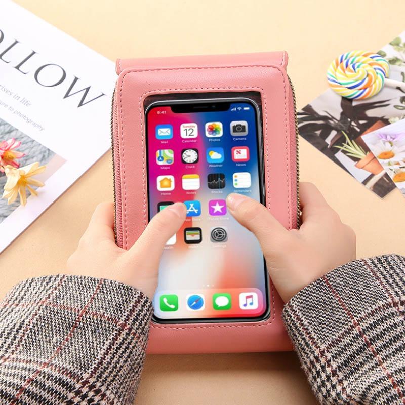 Universal crossbody phone case with adjustable strap, black PU leather; holds phone, cards, cash. Hands-free travel accessory.