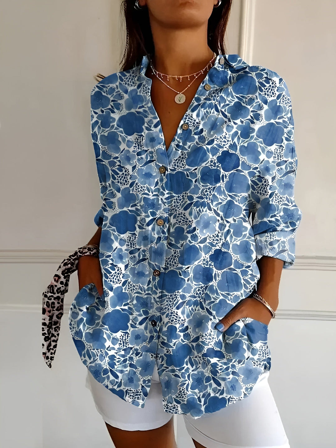Women's abstract print split-neck blouse, long sleeve, relaxed fit for versatile everyday style.