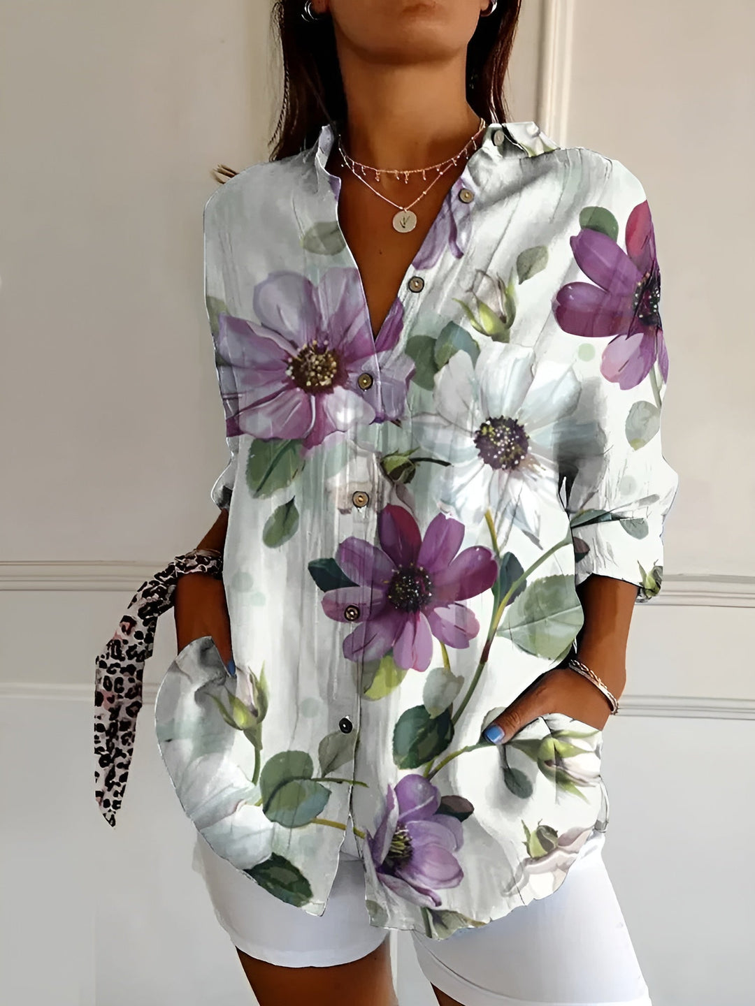 Comfortable and chic women's abstract print split-neck blouse. Long sleeve, relaxed fit, for all occasions.