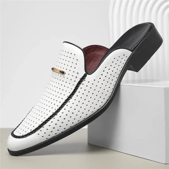 Underside of a women's perforated leather mule, showing the durable sole and construction