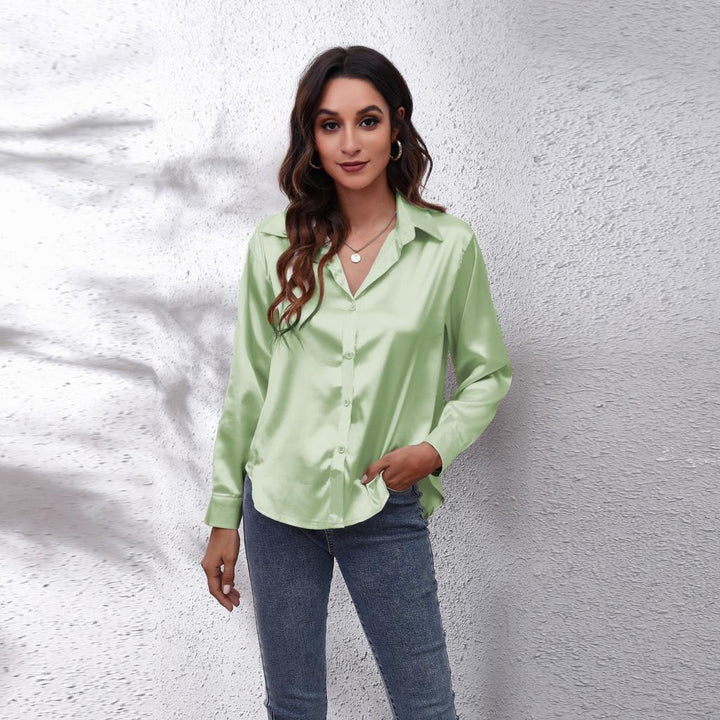 Model wearing a women's elegant loose fit satin blouse, showcasing its flowy design and casual appeal