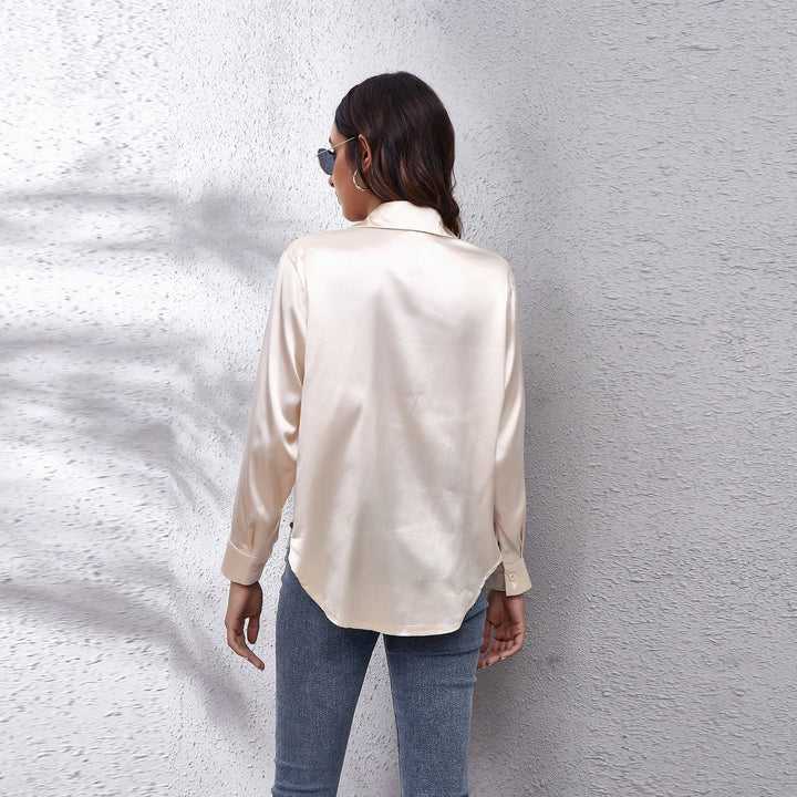 Stylish women's satin top with a relaxed fit, suitable for both casual wear and professional work environments