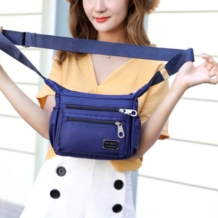Back view of the women's versatile nylon crossbody bag, showing a secure zippered pocket