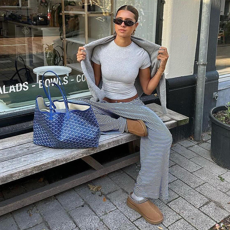 Comfortable women's relaxed fit trousers, featuring a stylish stripe pattern for casual spring fashion.