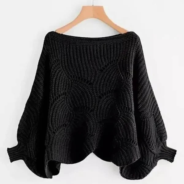 Close-up of the chunky knit texture on a women's batwing shawl sweater