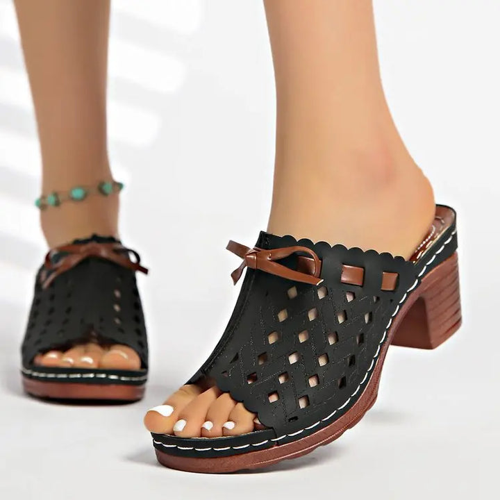 Women's casual open-toe mules with a fashionable cutout design and stable block heel.
