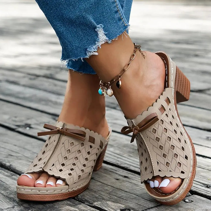 Summer-ready women's mules: cutout sandals with a comfortable block heel and open toe.