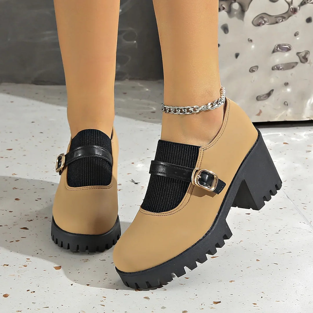 Stylish gray leather platform heels for women with an adjustable strap, combining comfort & fashion