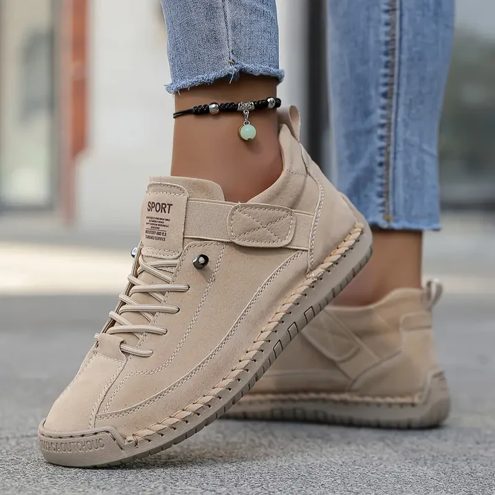 Women's comfortable lace-up walking sneakers in a bright color, perfect for spring casual wear.