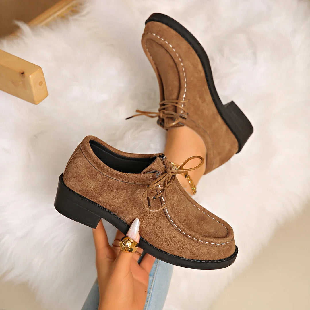 Side view of the women's comfort loafer, showing the low heel and supportive sole design