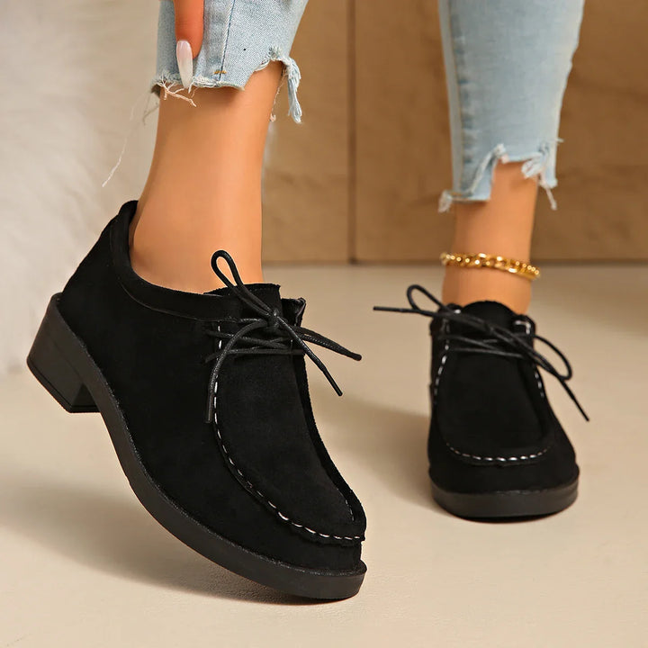 Detail shot of the lace-up closure on the women's comfort shoes, ensuring an adjustable fit