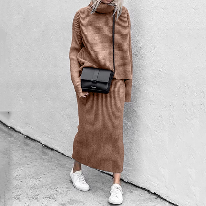 Close-up of a women's knitted coord set, highlighting the cozy texture of the pullover and ribbed skirt.