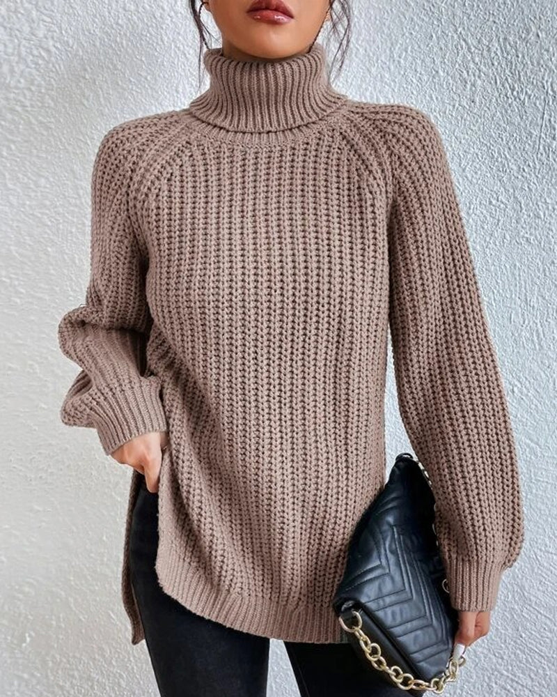 Back view of a women's long sleeve ribbed knit sweater, showing its consistent texture and cut.