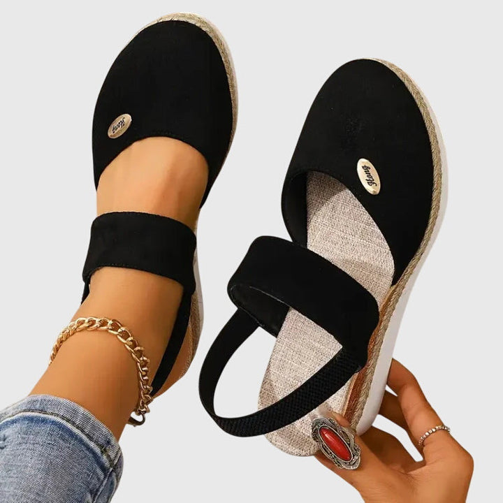 Women's orthopedic sandals on outdoor path, highlighting comfort, stability & pain relief for everyday wear.