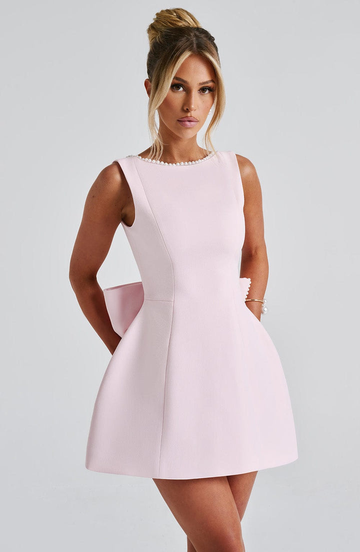 Women's elegant structured mini dress, perfect for cocktail parties & special occasions.