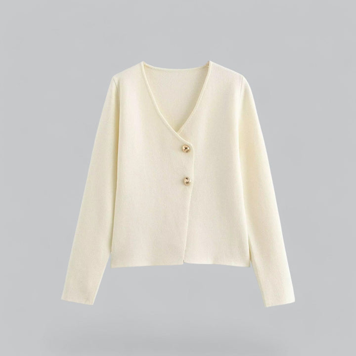 Close-up of a women's essential button cardigan, highlighting the soft knit texture and button detail.