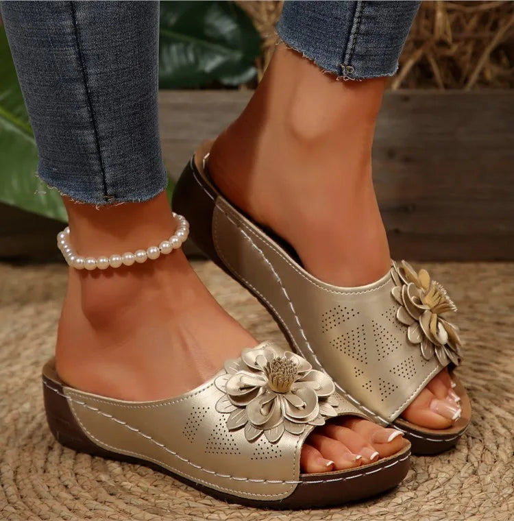 Floral pattern close-up on a comfort slide sandal, showing textile quality and vibrant colors