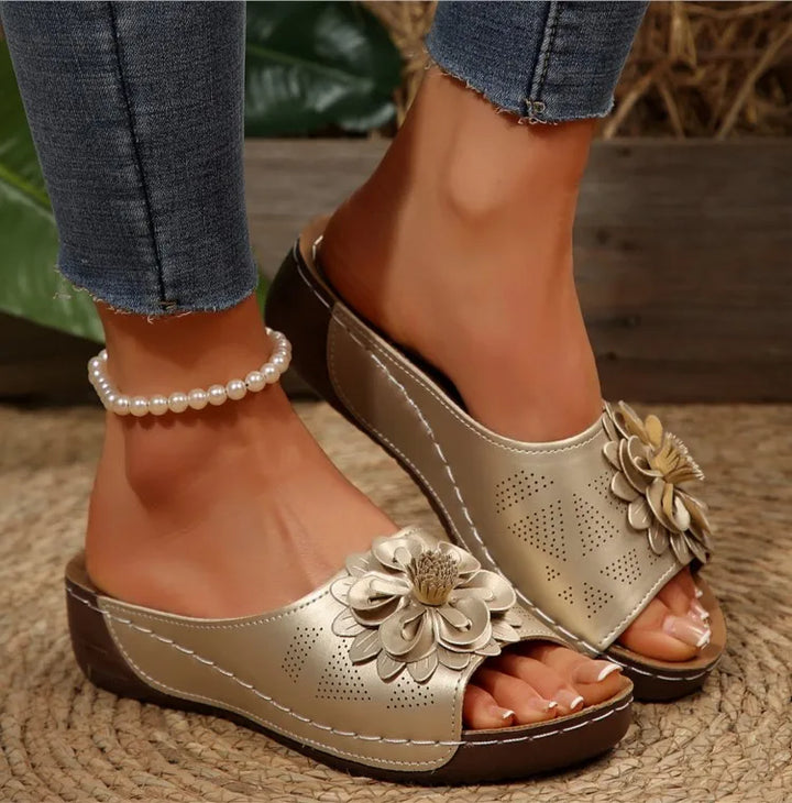 Floral pattern close-up on a comfort slide sandal, showing textile quality and vibrant colors